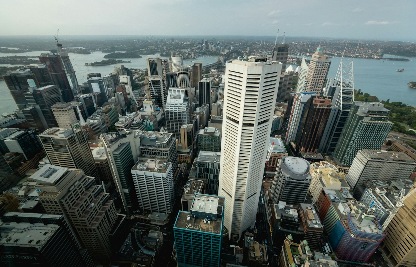 Sydney commercial buildings and harbour, illustrating Equity Tap secured business loans against Australian real estate